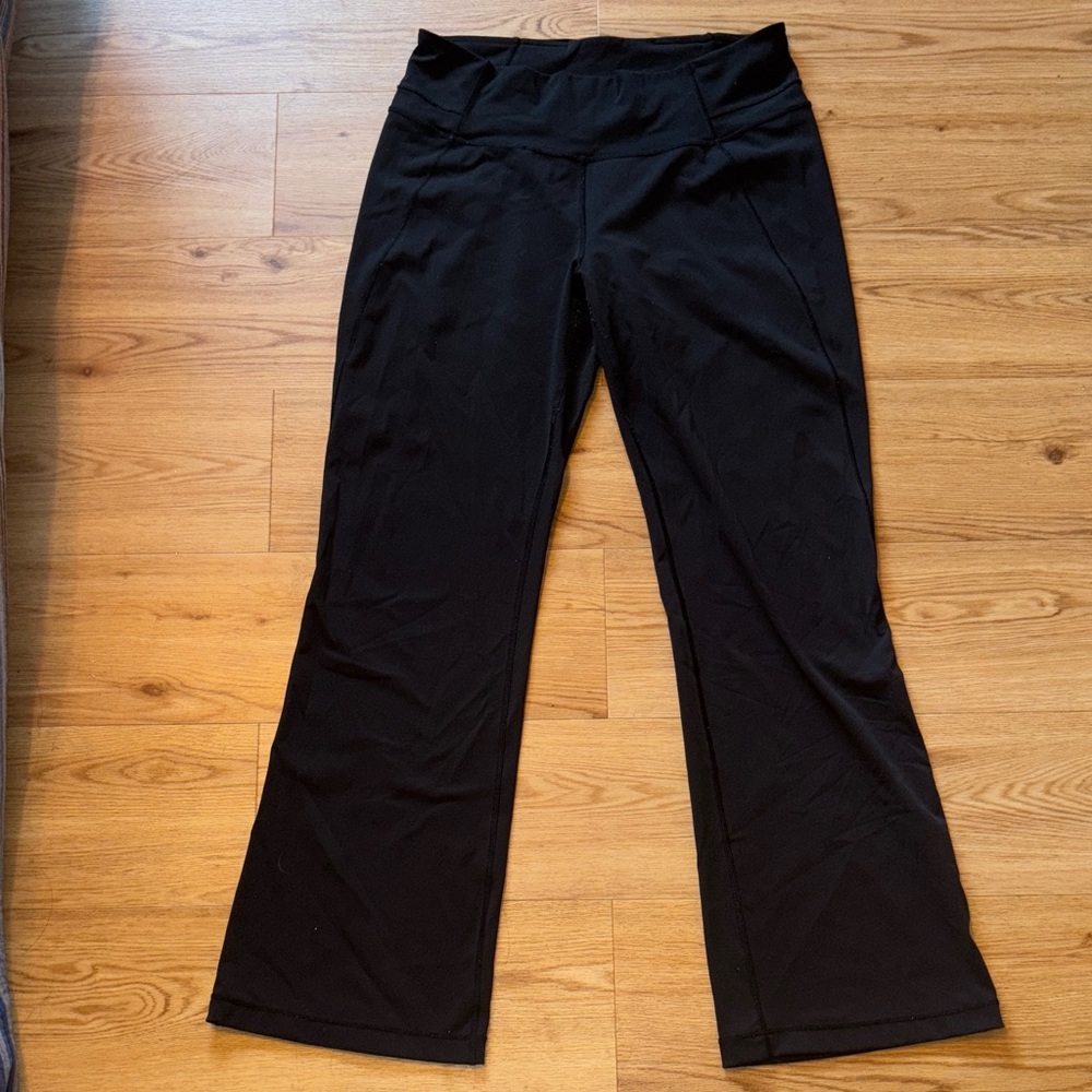 High rise, bootcut black lululemon yoga pants .